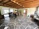 Expansive room featuring exposed ceiling, stone floors, and potential for customization at 6715 16Th N St, St Petersburg, FL 33702