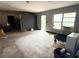 Open living room concept with unfinished floors, block wall, and lots of natural light at 6715 16Th N St, St Petersburg, FL 33702