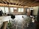 Large unfinished living room with exposed ceiling beams and several windows for natural light at 6715 16Th N St, St Petersburg, FL 33702