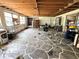 Renovation opportunity: Open space with natural light, unique flooring, and exposed beams at 6715 16Th N St, St Petersburg, FL 33702