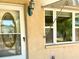 Attractive home exterior with an elegant front door and bright window at 7425 W Maryland W Ave, Hudson, FL 34667