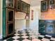 Unique kitchen features ample cabinet space, checkered flooring, and lots of natural light at 7425 W Maryland W Ave, Hudson, FL 34667