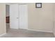 Bedroom showcases a closet with white bi-fold doors and neutral walls and carpet at 7533 Dunbridge Dr, Odessa, FL 33556