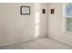 Clean bedroom featuring carpeted floor, a window letting in lots of light and wall decorations at 7533 Dunbridge Dr, Odessa, FL 33556