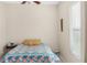 Cozy bedroom with simple decor and a bright window that allows natural light to shine in at 7533 Dunbridge Dr, Odessa, FL 33556