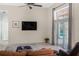 Bright and airy living room with tile floors and sliding door access to the pool area at 7533 Dunbridge Dr, Odessa, FL 33556