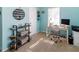 Cozy bedroom featuring light blue walls, a built in desk, and a bookshelf at 7714 Sailwinds Pass, Port Richey, FL 34668