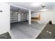 Spacious garage with two car capacity and freshly painted walls and floor at 7714 Sailwinds Pass, Port Richey, FL 34668