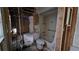 Stripped-down bathroom featuring a tub, toilet, and exposed framework, awaiting renovation at 7896 42Nd N Ave, St Petersburg, FL 33709