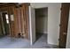 Bedroom closet with shelving and a view of the damaged walls at 7896 42Nd N Ave, St Petersburg, FL 33709