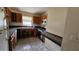 Kitchen with wood cabinets, tile flooring, and stainless-steel appliances at 7896 42Nd N Ave, St Petersburg, FL 33709