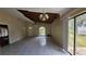 Living room features an open layout, damaged ceiling, and tile flooring at 7896 42Nd N Ave, St Petersburg, FL 33709