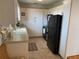 The kitchen features ample counter space, white cabinets, and modern appliances, perfect for cooking at 8055 112Th St # 406, Seminole, FL 33772