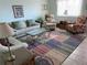Cozy living room with tile flooring, a comfortable seating arrangement, and plenty of natural light at 8055 112Th St # 406, Seminole, FL 33772