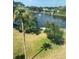 Scenic water view featuring a tranquil lake with a fountain, lush greenery, and clear blue skies at 8055 112Th St # 406, Seminole, FL 33772