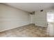Empty bedroom with tile floors, neutral walls, chair rail and views into the attached bathroom at 8110 Pond Shadow Ln, Tampa, FL 33635
