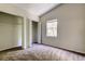 This bedroom features carpet flooring, a vaulted ceiling and a window at 8110 Pond Shadow Ln, Tampa, FL 33635