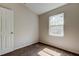 This bedroom features carpet flooring, neutral walls and a bright window at 8110 Pond Shadow Ln, Tampa, FL 33635