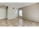 Bedroom with tile flooring, neutral walls, chair rail, and entry door and window at 8110 Pond Shadow Ln, Tampa, FL 33635