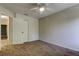 A sunlit bedroom features carpet flooring, neutral walls, and a ceiling fan with light at 8110 Pond Shadow Ln, Tampa, FL 33635