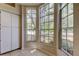 Bright breakfast nook with large windows offering a view of the surrounding greenery and tile floors at 8110 Pond Shadow Ln, Tampa, FL 33635