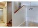 Entryway with staircase, carpeted steps, and tile floors that lead into the main living area at 8110 Pond Shadow Ln, Tampa, FL 33635