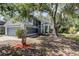 Charming two-story home with mature landscaping at 8110 Pond Shadow Ln, Tampa, FL 33635