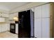 Functional kitchen featuring modern appliances, white cabinets, and ample counter space for meal preparation at 8110 Pond Shadow Ln, Tampa, FL 33635