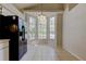 Bright kitchen nook with a large bay window offering views of the landscaped backyard and natural light at 8110 Pond Shadow Ln, Tampa, FL 33635