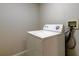 Laundry area with a white washing machine at 8110 Pond Shadow Ln, Tampa, FL 33635