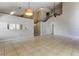 Open-concept living room with tile flooring, view to second floor and staircase at 8110 Pond Shadow Ln, Tampa, FL 33635