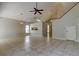 Open concept living room features a view of the kitchen and a doorway leading to other rooms at 8110 Pond Shadow Ln, Tampa, FL 33635