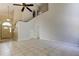 Bright living room features high ceilings, tile floors, and a front door with decorative half-round window at 8110 Pond Shadow Ln, Tampa, FL 33635
