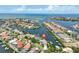 Aerial view of waterfront community, homes with docks and access to Gulf of Mexico at 915 Symphony Isles Blvd, Apollo Beach, FL 33572