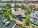 Aerial view showcasing waterfront home with a screened lanai, pool, boat dock and Gulf access at 915 Symphony Isles Blvd, Apollo Beach, FL 33572