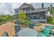 Spacious backyard with a pool, patio, and lush landscaping, ideal for relaxation at 915 Symphony Isles Blvd, Apollo Beach, FL 33572