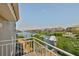 Balcony offering views of the tranquil waterway, showcasing waterfront living at its finest at 915 Symphony Isles Blvd, Apollo Beach, FL 33572