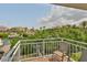 The brick-laid balcony overlooks lush greenery and waterways, offering a serene outdoor space at 915 Symphony Isles Blvd, Apollo Beach, FL 33572