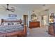 Cozy bedroom with wood furniture and carpet floors at 915 Symphony Isles Blvd, Apollo Beach, FL 33572
