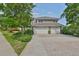 Spacious three-car garage with a brick paver driveway at 915 Symphony Isles Blvd, Apollo Beach, FL 33572