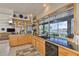 Kitchen with granite countertops, stainless steel appliances, and wine storage at 915 Symphony Isles Blvd, Apollo Beach, FL 33572
