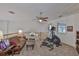 Cozy living room with a ceiling fan, sofa, and exercise equipment at 915 Symphony Isles Blvd, Apollo Beach, FL 33572