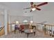 Cozy loft area with comfortable seating, ideal for relaxation and overlooking the living area below at 915 Symphony Isles Blvd, Apollo Beach, FL 33572