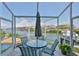 Relaxing outdoor dining area overlooking the water, perfect for entertaining guests at 915 Symphony Isles Blvd, Apollo Beach, FL 33572