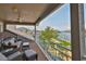 Relaxing covered patio seating area with stunning waterfront views at 915 Symphony Isles Blvd, Apollo Beach, FL 33572