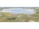 An aerial view showcasing a marsh with lake access at 9722 Kenton Rd, Wesley Chapel, FL 33545