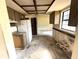 A kitchen renovation project showcasing wood cabinets, appliances, window, and potential for modernization and customization at 9722 Kenton Rd, Wesley Chapel, FL 33545