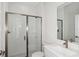 Bathroom with a large glass shower, sink and toilet at 10017 Surrey Rose Dr, San Antonio, FL 33576