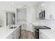 Contemporary kitchen showcases ample counter space, stainless appliances, and stylish cabinetry providing a great space at 10017 Surrey Rose Dr, San Antonio, FL 33576