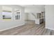 Spacious living area showcases large windows, neutral walls, and seamless flooring, creating a bright and airy atmosphere at 10017 Surrey Rose Dr, San Antonio, FL 33576
